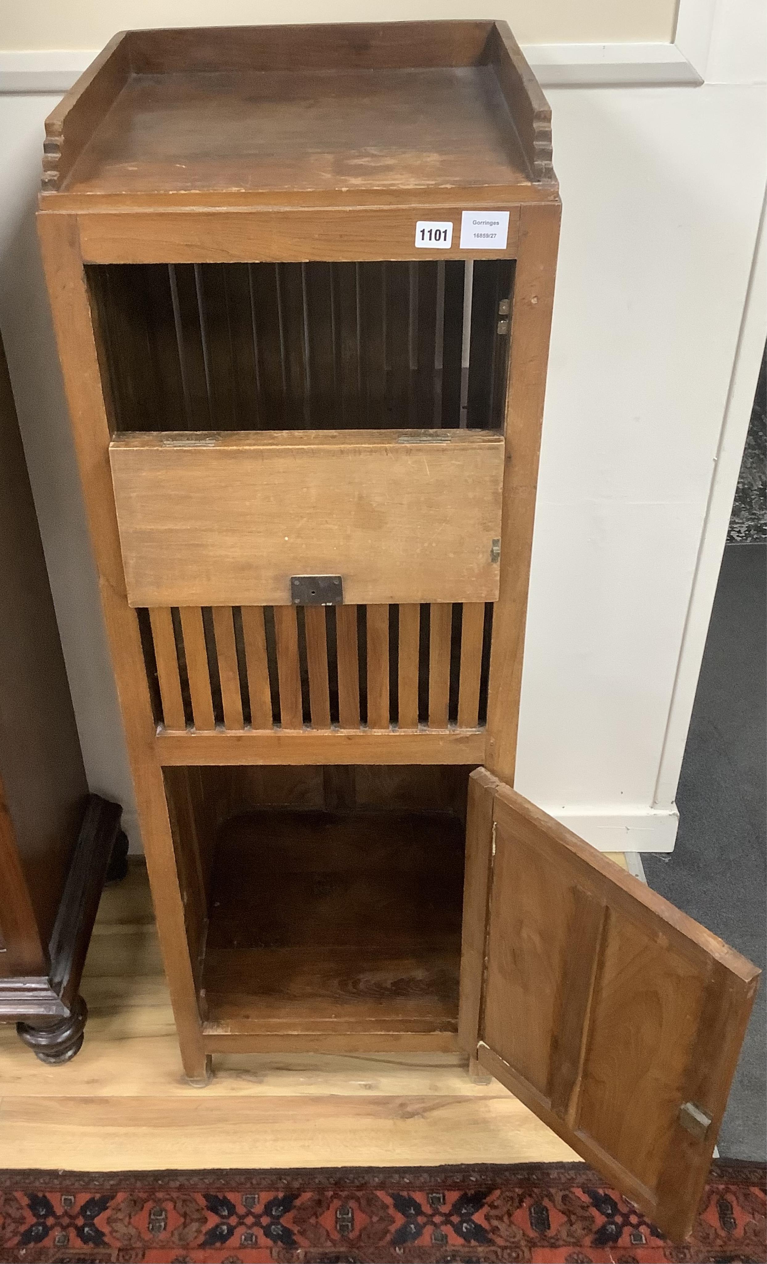 A 20th century Arts & Crafts style Anglo Indian teak laundry cabinet, width 45cm, depth 45cm, height 135cm. Condition - fair